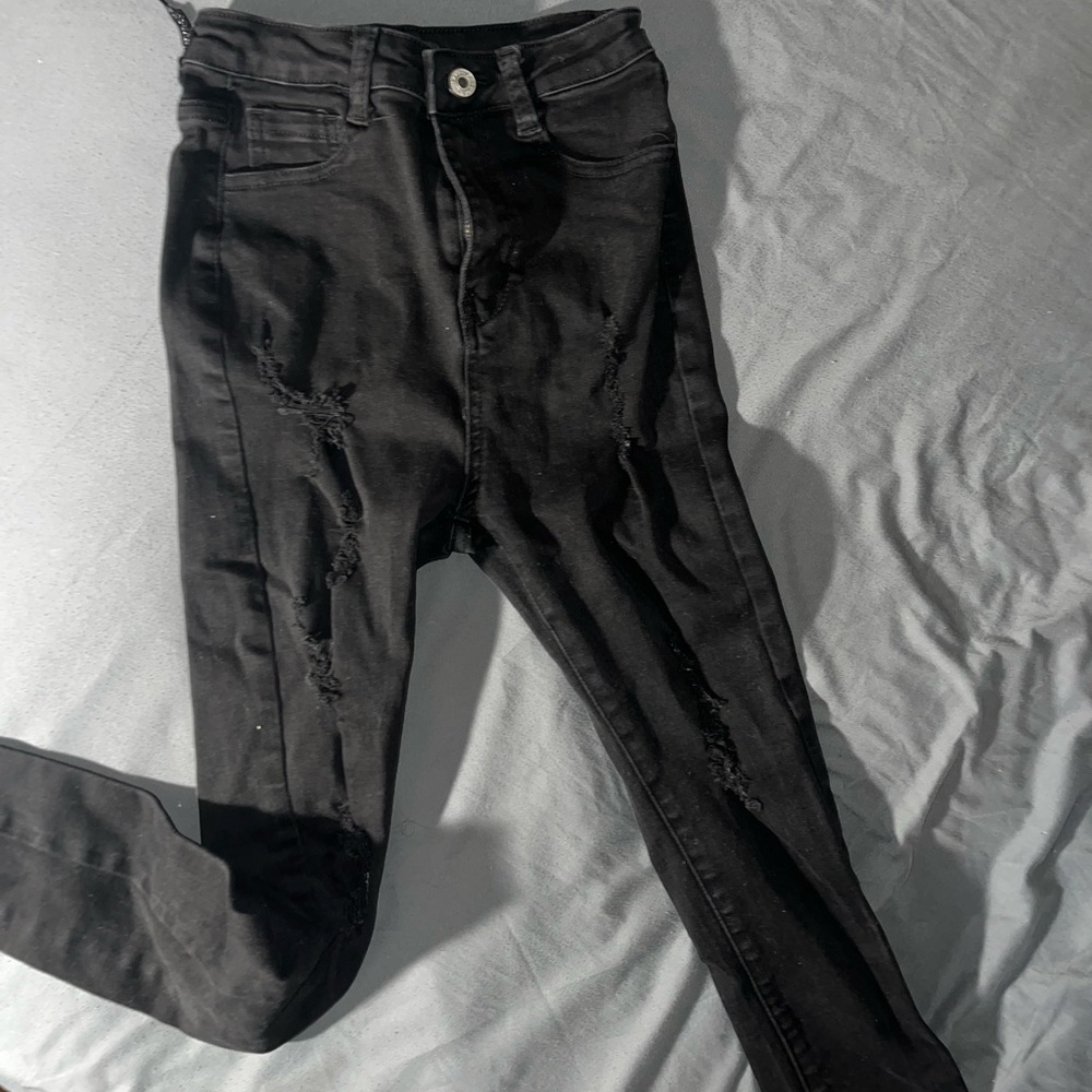 NVGTN black skinny athletic jeans , with holes, size M
